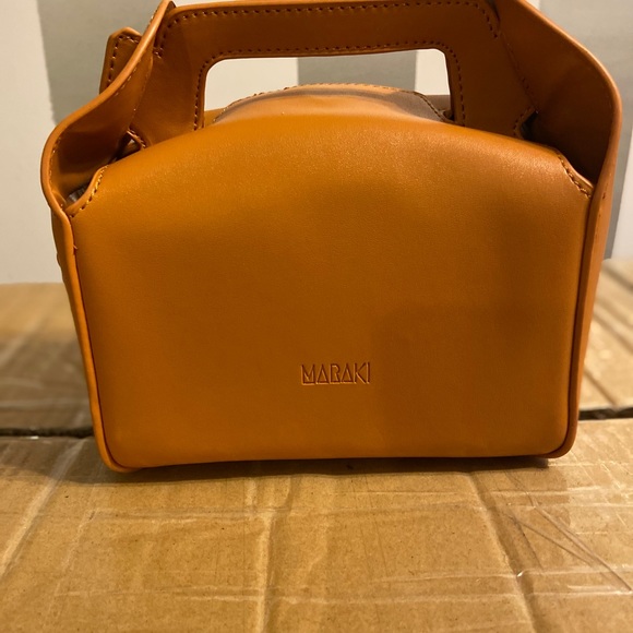 Two different styles of bags tan togo bag and black onyx cube bag - Picture 3 of 7